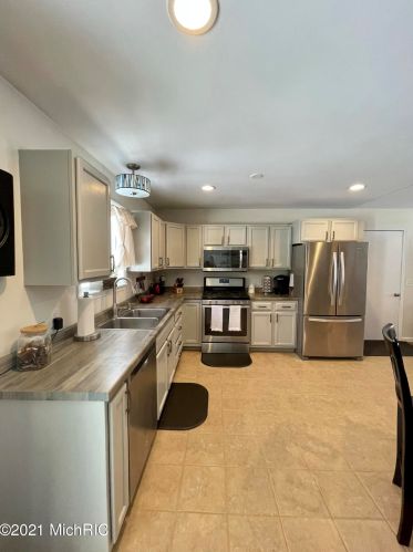 5541 Lamos Rd, Sylvan Beach MI 49461-9450 exterior