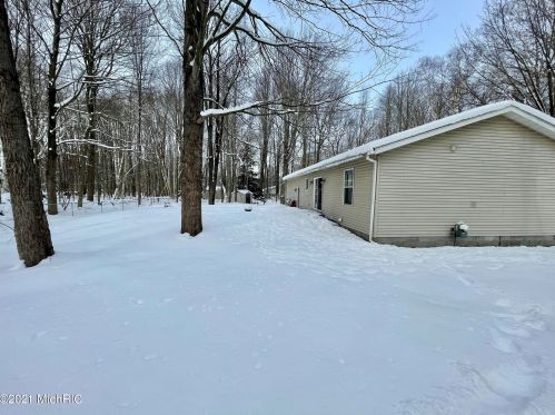 5541 Lamos Rd, Sylvan Beach MI 49461-9450 exterior