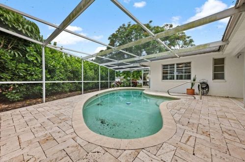 59 Pebble Bch Blvd, Naples FL 34113-8349 exterior
