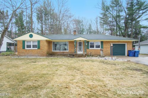 501 Alice St, Sylvan Beach, MI 49461-1411